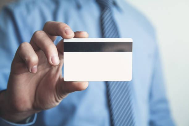 istock Businessman showing credit card. 948187658
