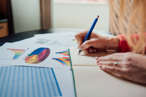 istock A businesswoman writes 948197084