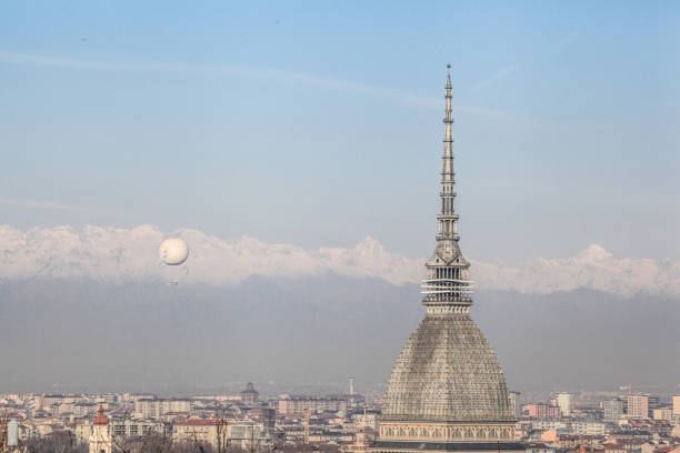 Piazza Vittorio Veneto, Mole Antonelliana and Alps at night in Turin, Italy