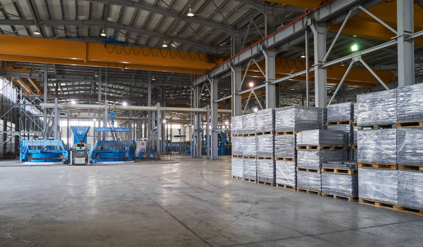 istock Large warehouse hangar of factory interior 948209216