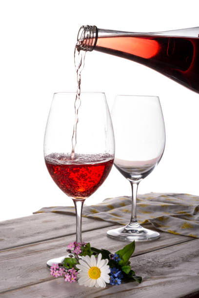 istock Rose wine served with two glasses and flowers copy space close up 948240424