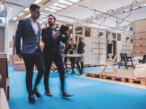istock Businessmen walking in the open office environment 948244752