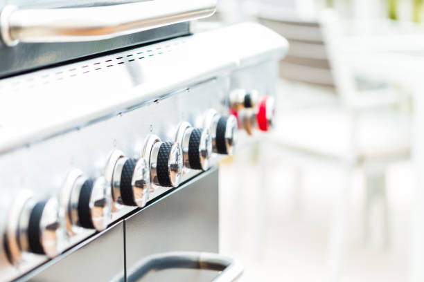 istock Close up of control knobs on outdoor 6 burner gas grill. 948250968