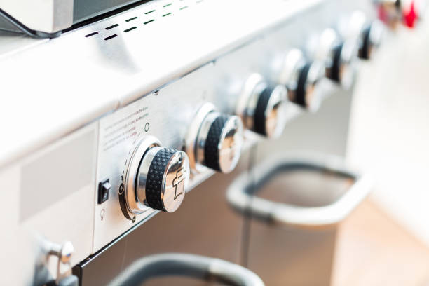 istock Close up of control knobs on outdoor 6 burner gas grill. 948250974