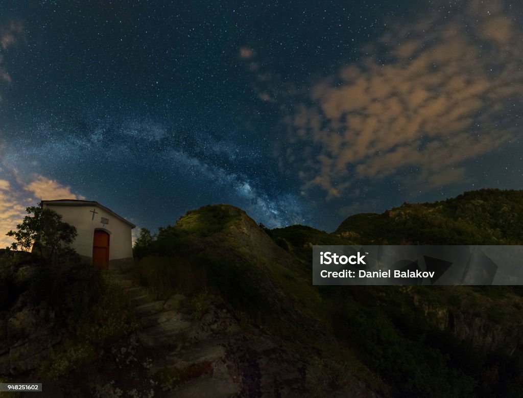 Nightscapes with starry sky over a chapel Astronomy Stock Photo