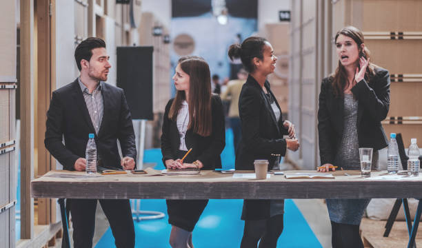 istock Group of creative business people standing behind the desk 948255632