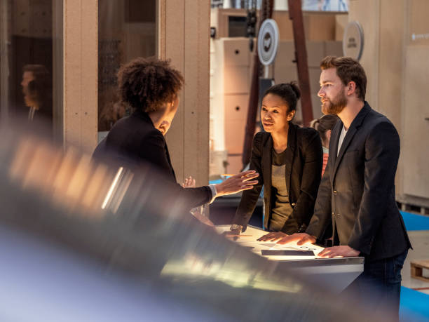 istock Group of creative business people standing behind the desk 948257778