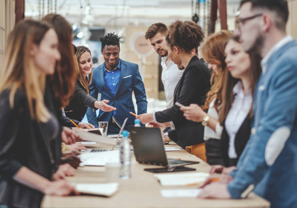 istock Group of creative business people standing behind the desk 948262340