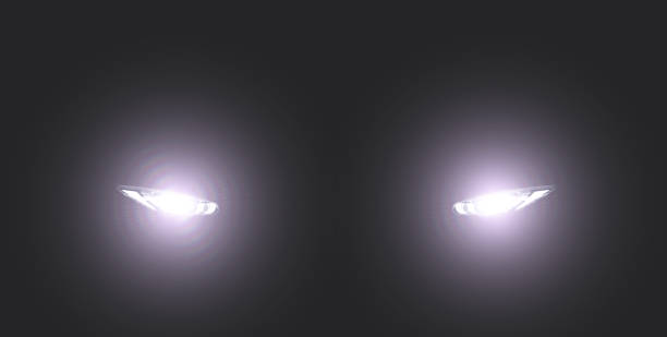xenon car headlight in foggy dark creepy glowing eyes stock pictures, royalty-free photos & images