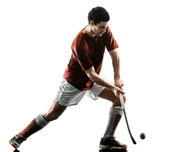 istock field hockey player man isolated silhouette white background 948289900
