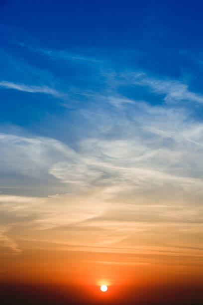 istock Natural Sunset Sunrise Over Field. Bright Dramatic Sky And Dark Ground. Landscape Under Scenic Colorful Sky Warm Colours 948301348