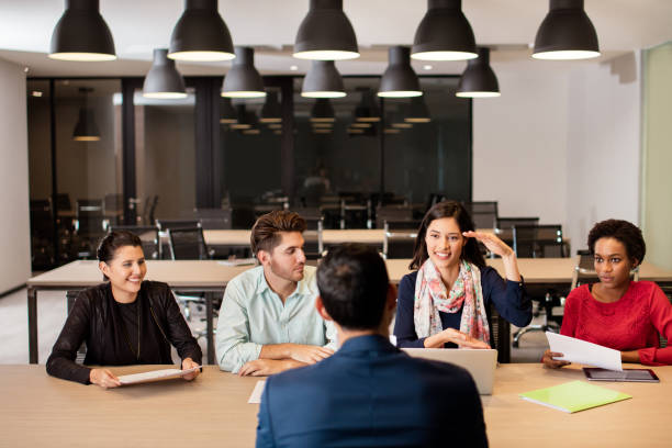 istock Young people having a meeting at workplace 948308332