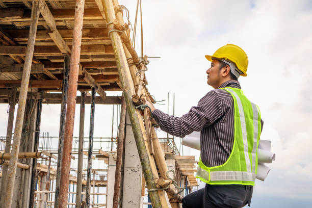 istock professional engineer worker at the house building construction site 948328602