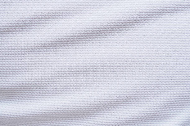 White football jersey clothing fabric texture sports wear background White football jersey clothing fabric texture sports wear background, close up baseball uniform photos stock pictures, royalty-free photos & images