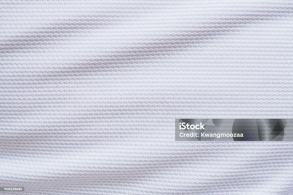 Camisa de futebol branca vestuário tecido textura esportes desgaste fundo - Foto de stock de Texturizado - Descrição Geral royalty-free