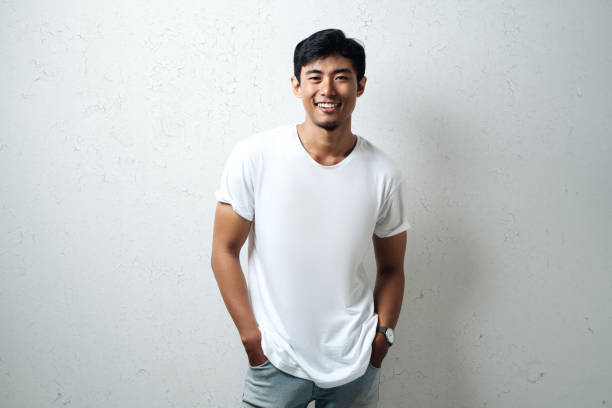 istock Handsome asian man in white blank t-shirt 948328822