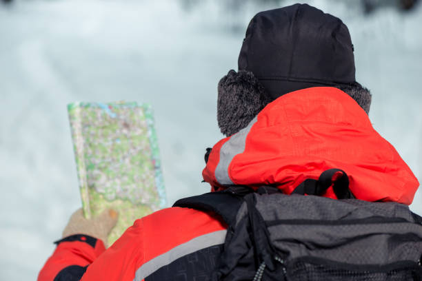 istock male tourist with map in hand, view from back 948328864