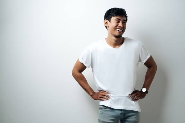 istock Handsome asian man in white blank t-shirt 948328926
