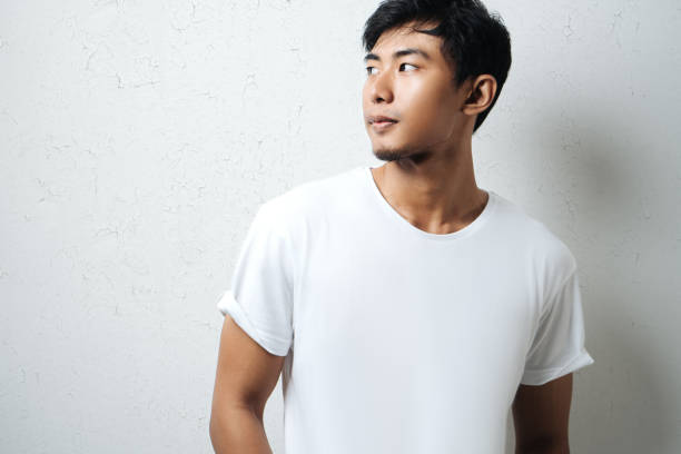 istock Handsome asian man in white blank t-shirt 948328928
