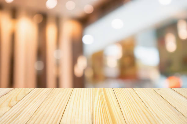 istock wood table with abstract blurred cafe restaurant with bokeh lights defocused background 948329274