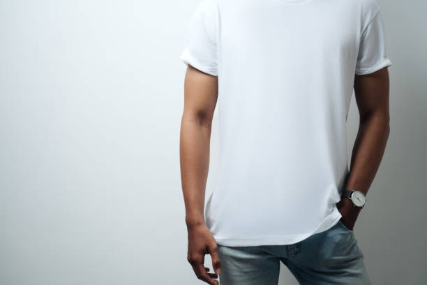 istock white blank t-shirt close-up, male model 948331424
