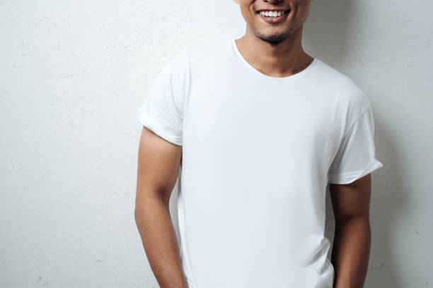 istock white blank t-shirt close-up, male model 948333624