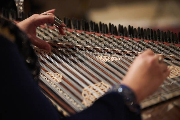 istock Woman Hands playing on a harp 948334082