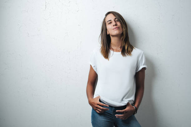 istock Handsome woman in white blank t-shirt, studio model 948336612