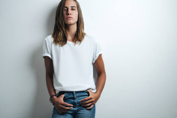 istock Handsome woman in white blank t-shirt, studio model 948336628