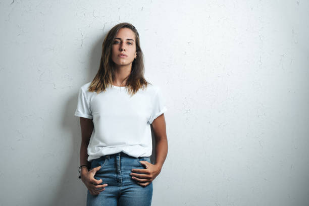 istock Handsome woman in white blank t-shirt, studio model 948336676
