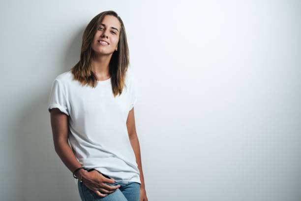 istock Handsome woman in white blank t-shirt, studio model 948336744