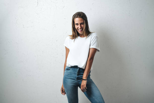 istock Handsome woman in white blank t-shirt, studio model 948336924