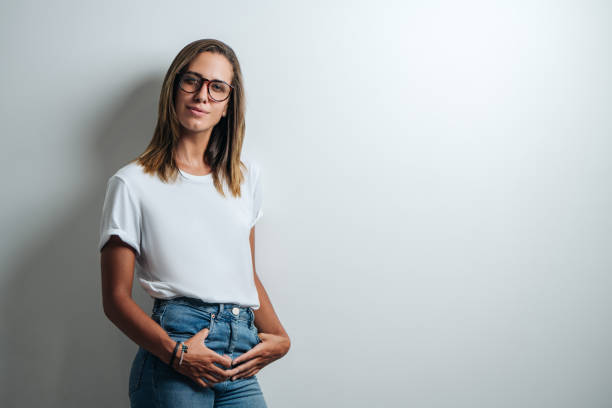 istock Handsome woman in white blank t-shirt, studio model 948337052