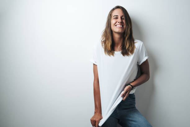 istock Handsome woman in white blank t-shirt, studio model 948337056