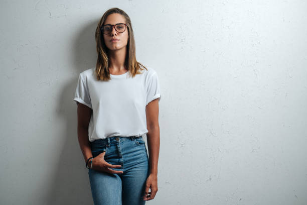 istock Handsome woman in white blank t-shirt, studio model 948337060