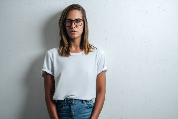 istock Handsome woman in white blank t-shirt, studio model 948337064
