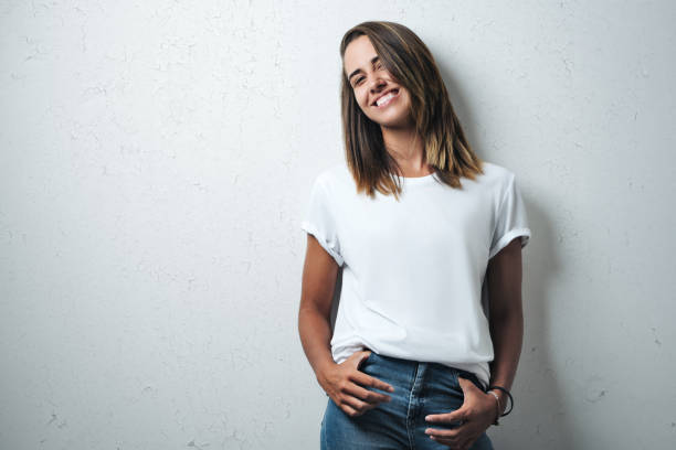 handsome woman in white blank t-shirt, studio model - white clothing imagens e fotografias de stock