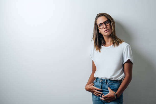 istock Handsome woman in white blank t-shirt, studio model 948337280