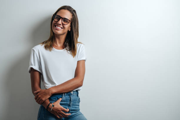 istock Handsome woman in white blank t-shirt, studio model 948337282