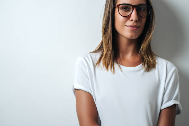 istock white blank t-shirt, woman model close-up 948337340