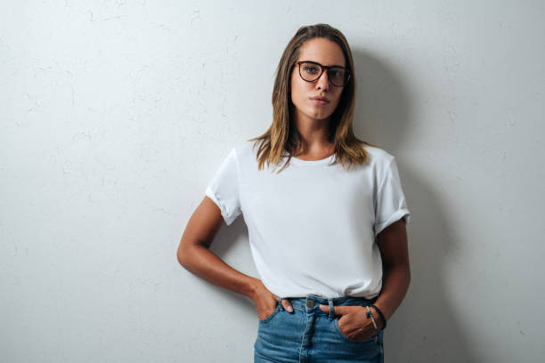 istock Handsome woman in white blank t-shirt, studio model 948337400