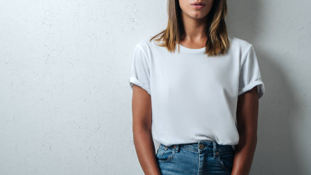 istock white blank t-shirt, woman model close-up 948337480