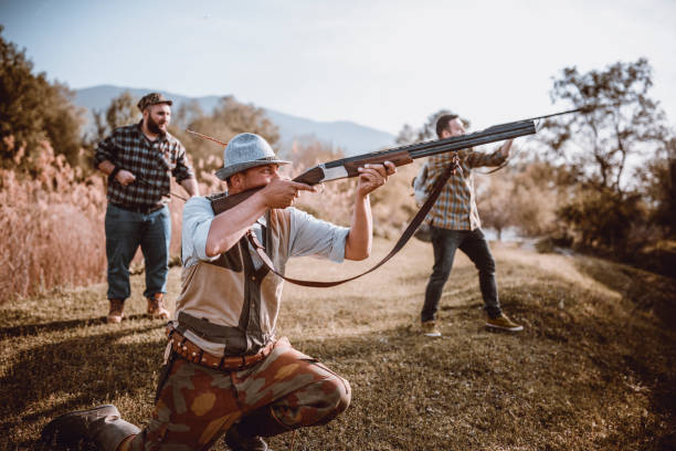 istock Group of Hunters with Their Dogs in Action 948340370
