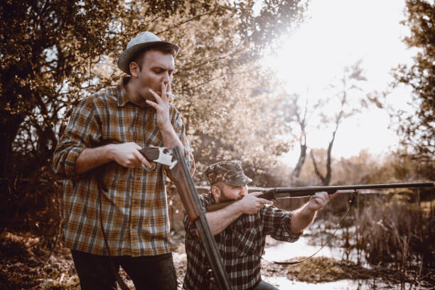 istock Group of Hunters Preparing for Hunting in Forest 948352184