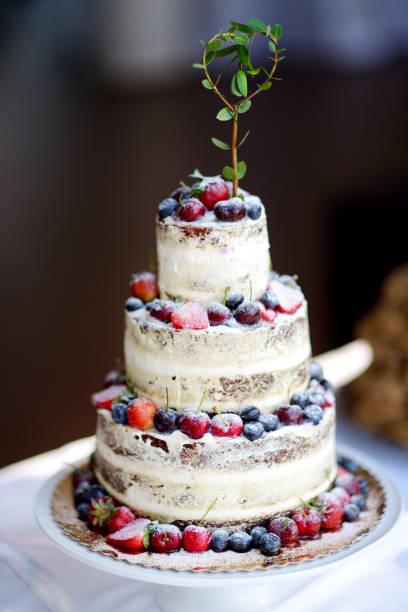istock Delicious chocolate wedding cake decorated with fruits and berries 948352414