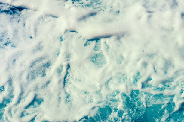 foam on the blue sea. sea water top view. sea foam
