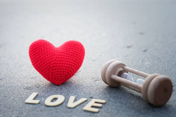 istock Red heart on the sand surface,vacation card with copy space 948369142
