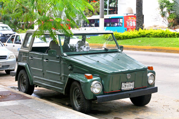 Havana, Cuba - December 9th 2022: Classic vintage cars driving along at old Havana. Old Havana is one the most unique and charming places for tourists in the world for its time-capsuled buildings and lifestyles.