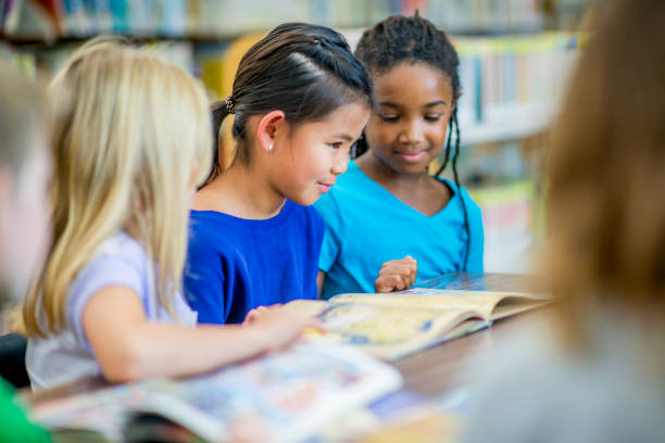 istock Girls Reading Together 948384568