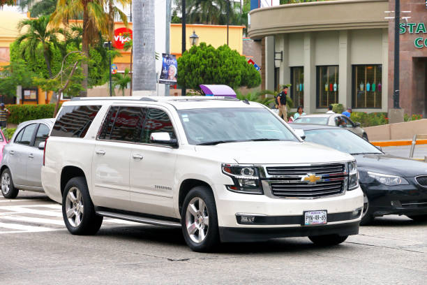 Chevrolet Suburban Acapulco, Mexico - May 30, 2017: White motor car Chevrolet Suburban in the city street. Chevrolet stock pictures, royalty-free photos & images